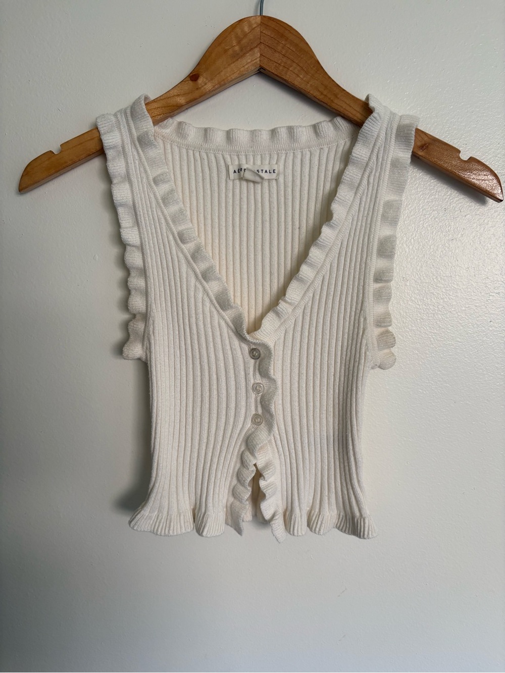 Cream ribbed knit crop top with ruffles